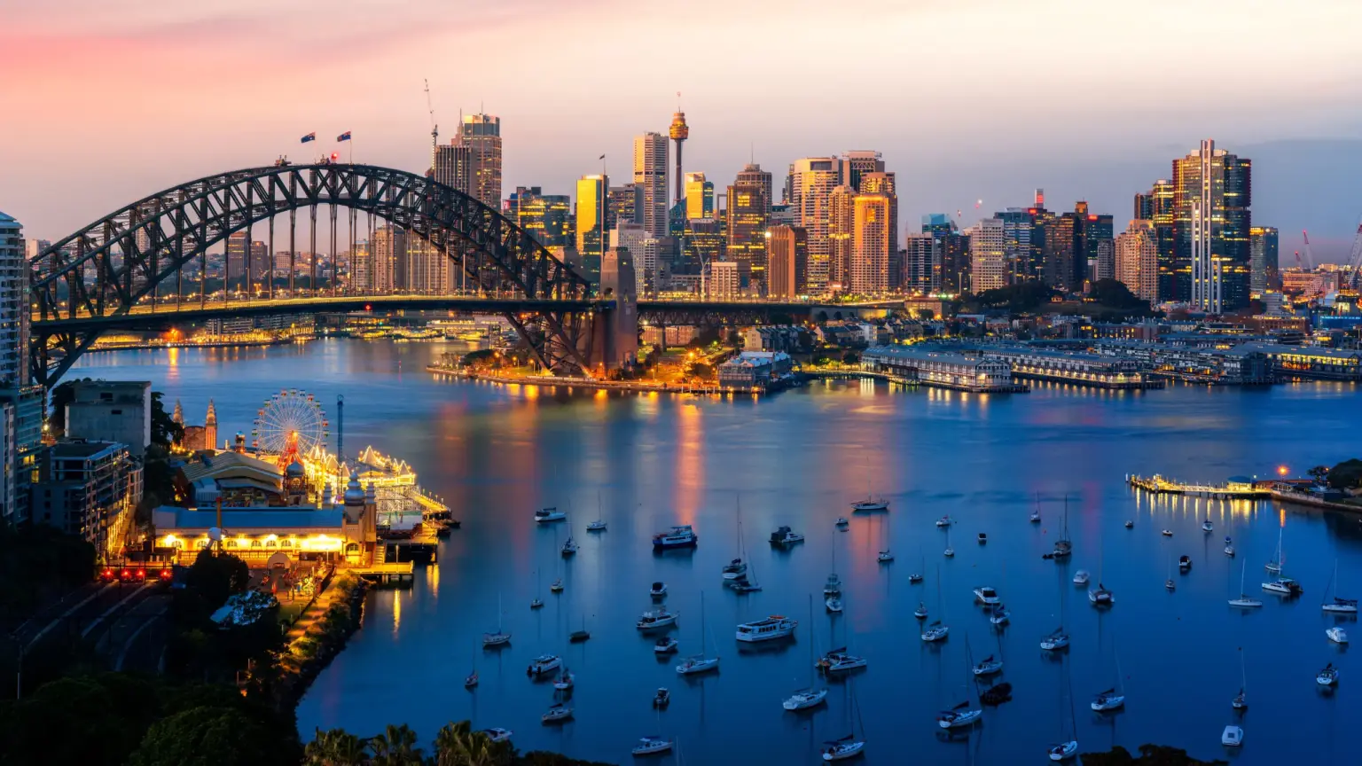 Sydney Harbour Bridge and the Sydney CBD skyline at dusk